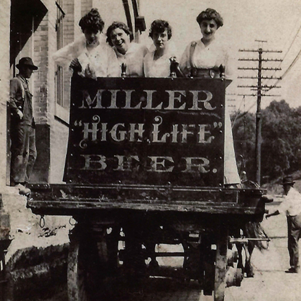 Womens over an Miller High Life ad